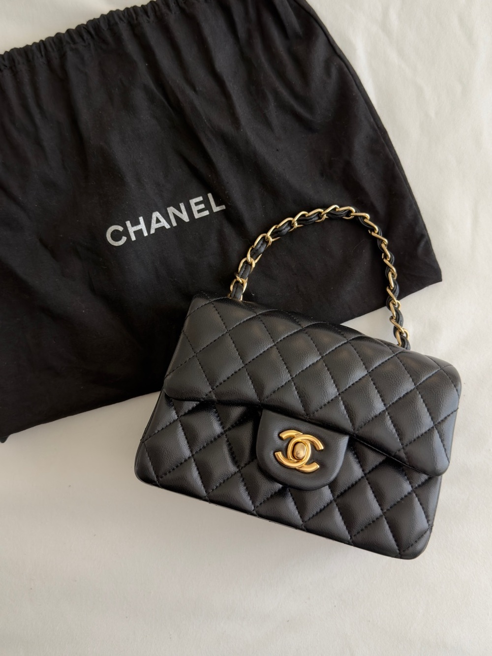 CHANEL Black Quilted Shoulder Bag with Gold Chain and CC Turnlock